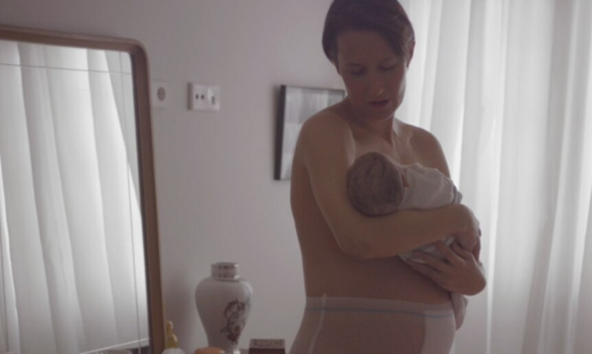 Woman holding a new born baby