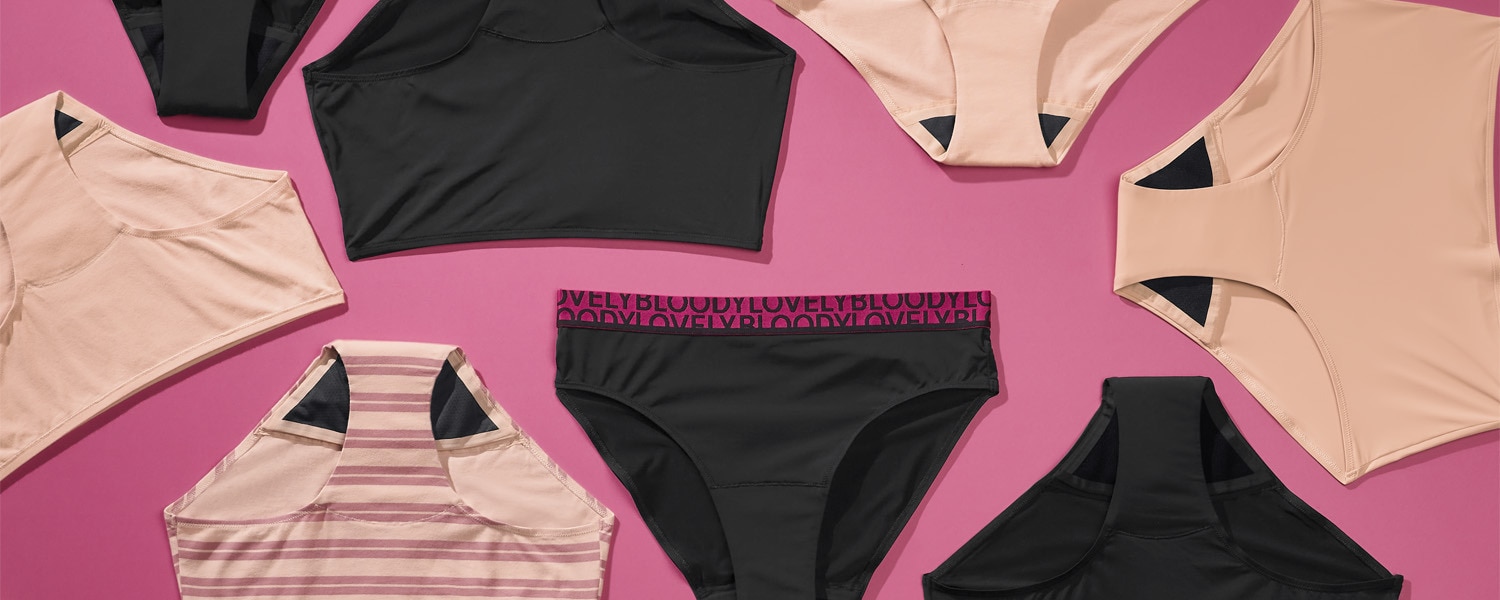 a range of styles of bodyform period pants lay flat on a pink background