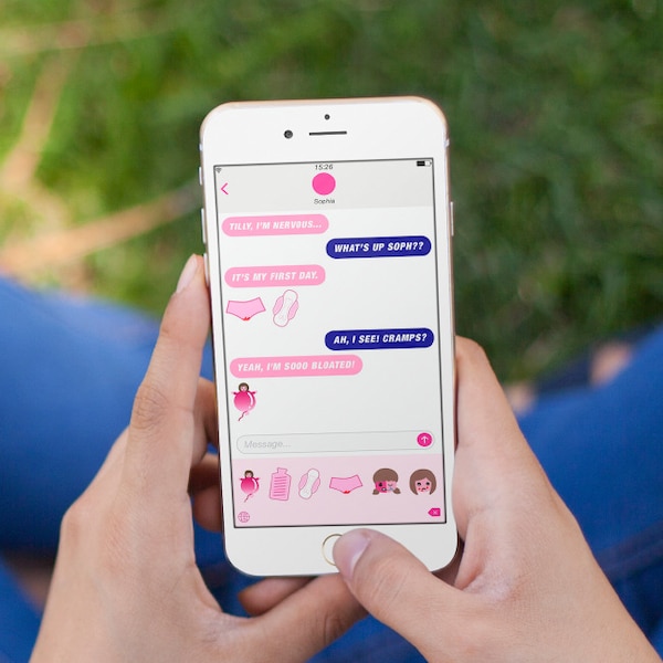 Image of a woman texting on her phone and using the Femoji app - Libresse