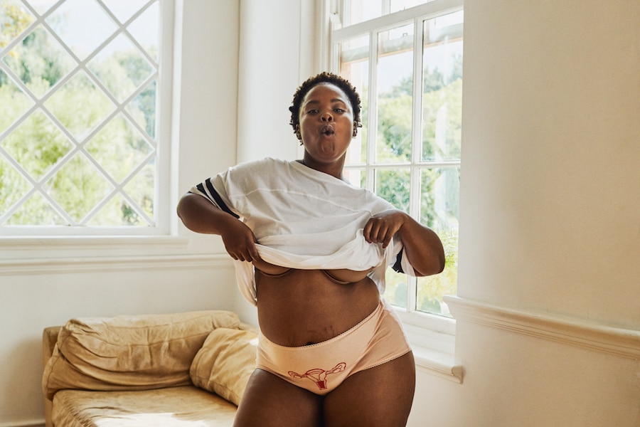 A portrait photo of a woman in embroidered underwear
