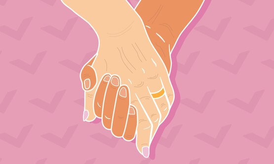 A middle-aged couple holding hands.