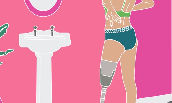 Woman with a leg prosthesis wearing period pants in a bathroom, looking in the mirror. Menstrual cup on the shelf.