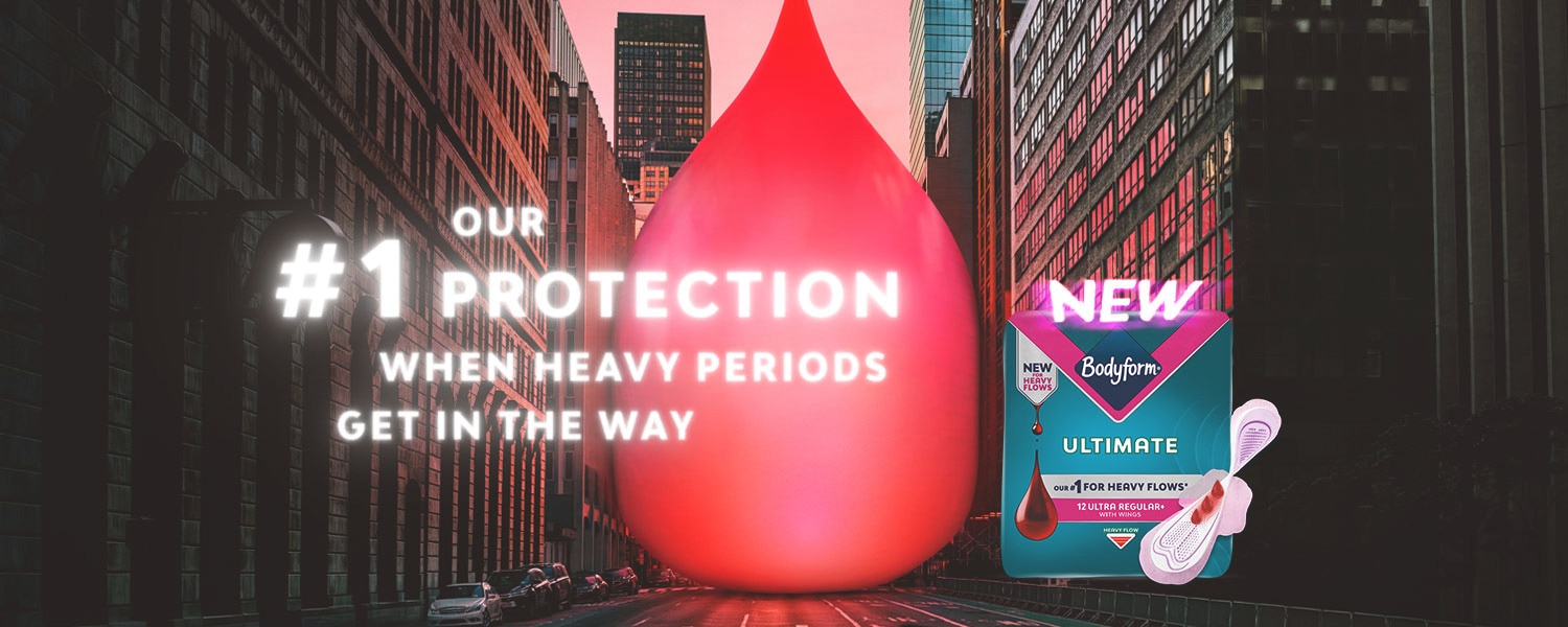 Bodyform Ultimate pads ad with red droplet in city street and product packaging