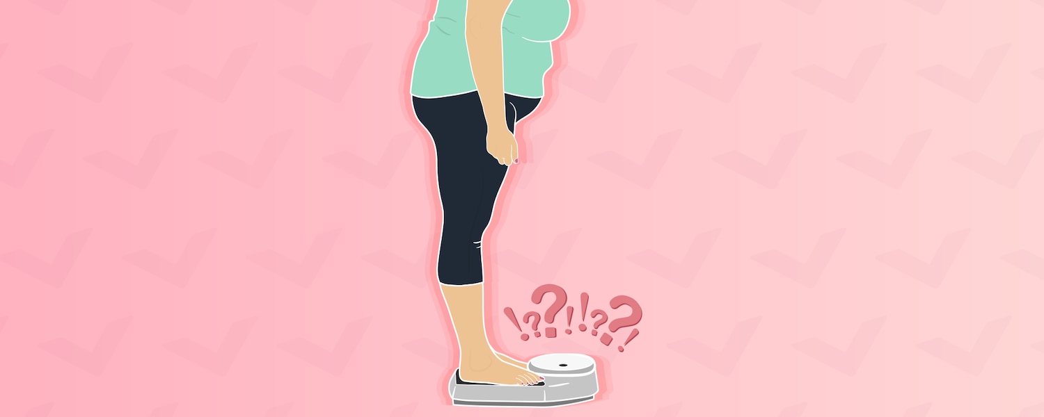 Menopausal woman standing on a scale