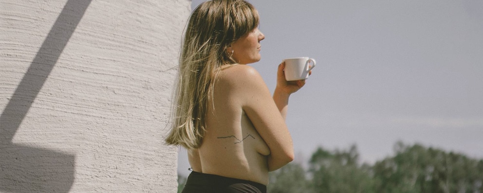 A woman with the cup of coffee