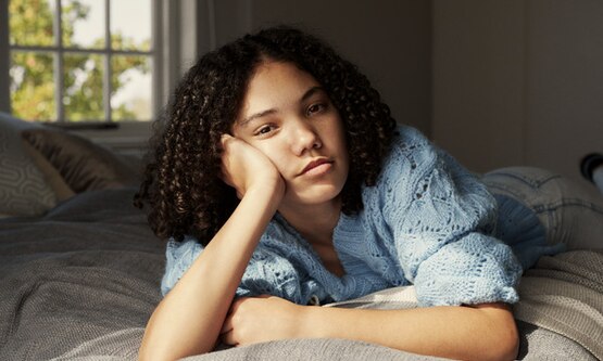 Woman looking exasperated due to period coming