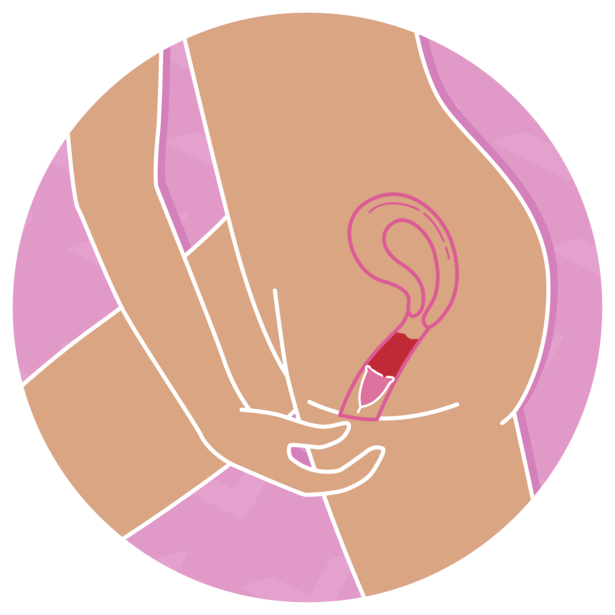 A person inserting a menstrual cup into their vagina