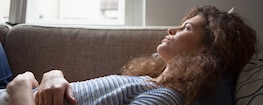 1500x600 Lady Holding Stomach