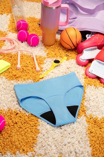 Blue period pants on yellow carpet