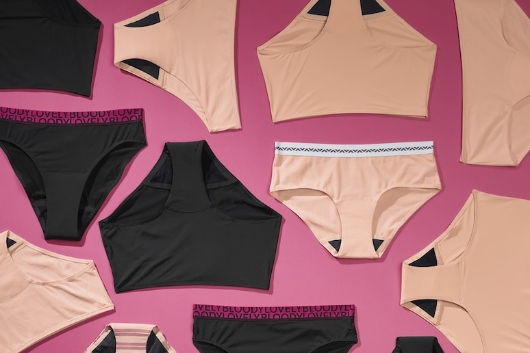 a range of styles of bodyform period pants lay flat on a pink background
